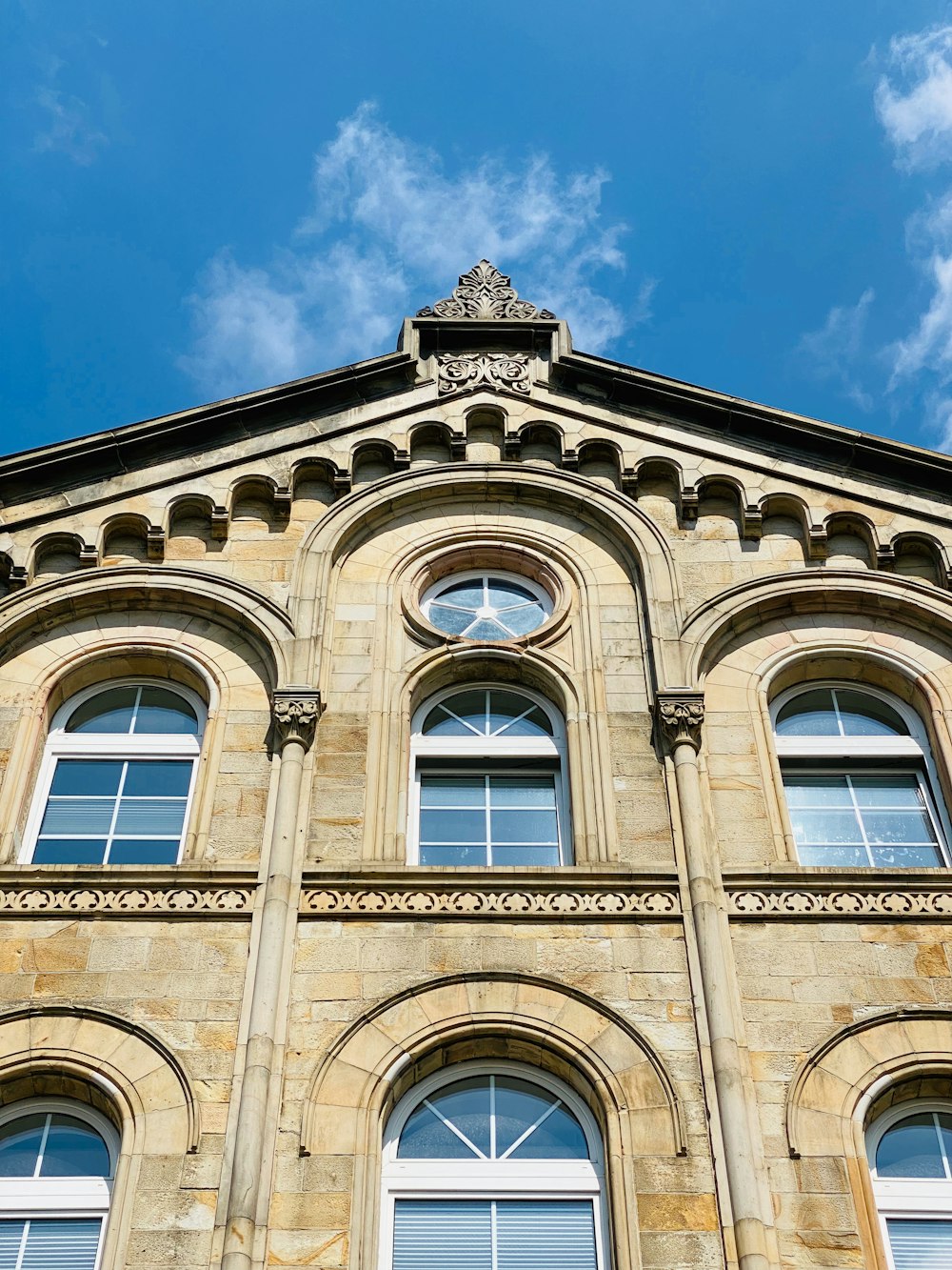 a building with windows and a blue sky