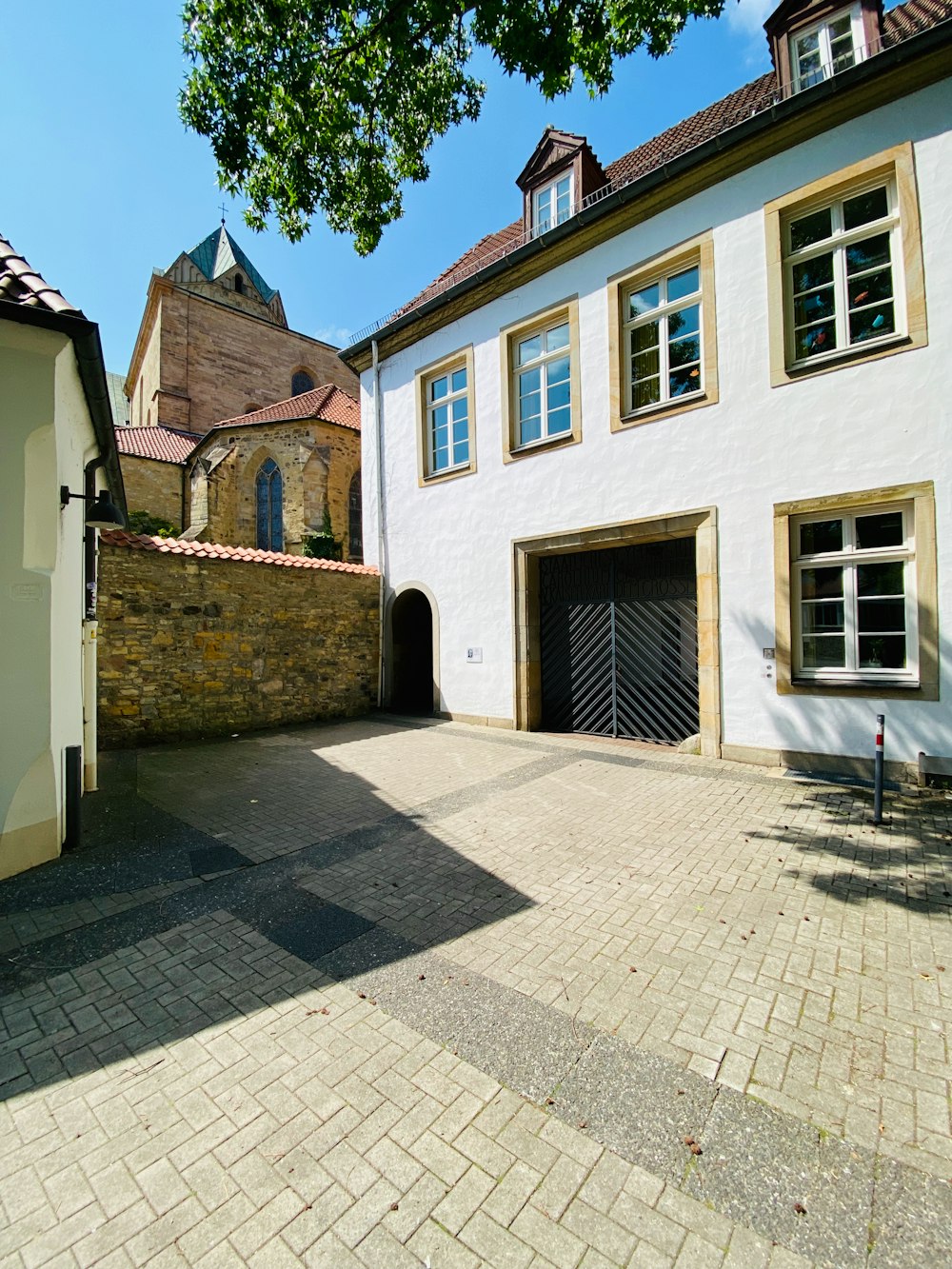 a brick road with buildings on either side of it