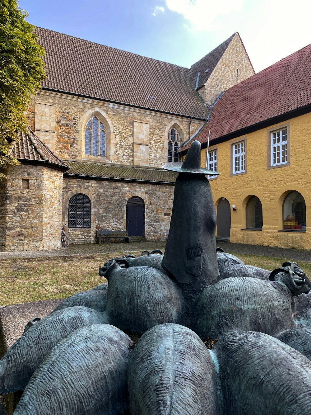 a group of statues in front of a building