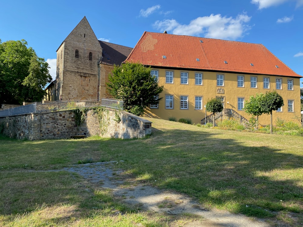 a large building with a brick wall