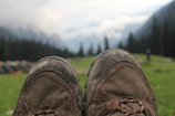 Sturdy hiking boots with rough terrain in the background