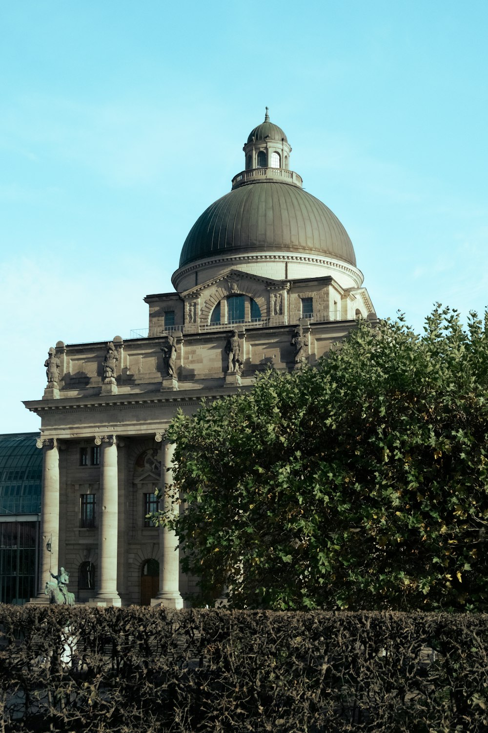 a building with a dome and columns