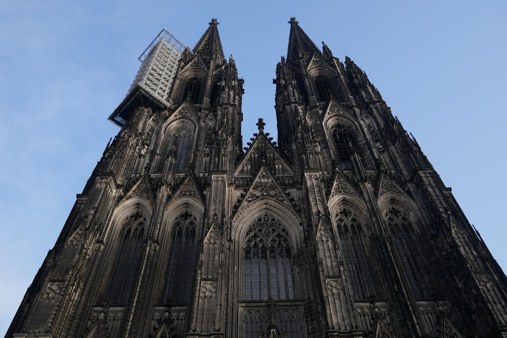 a large stone building with Cologne Cathedral in the background