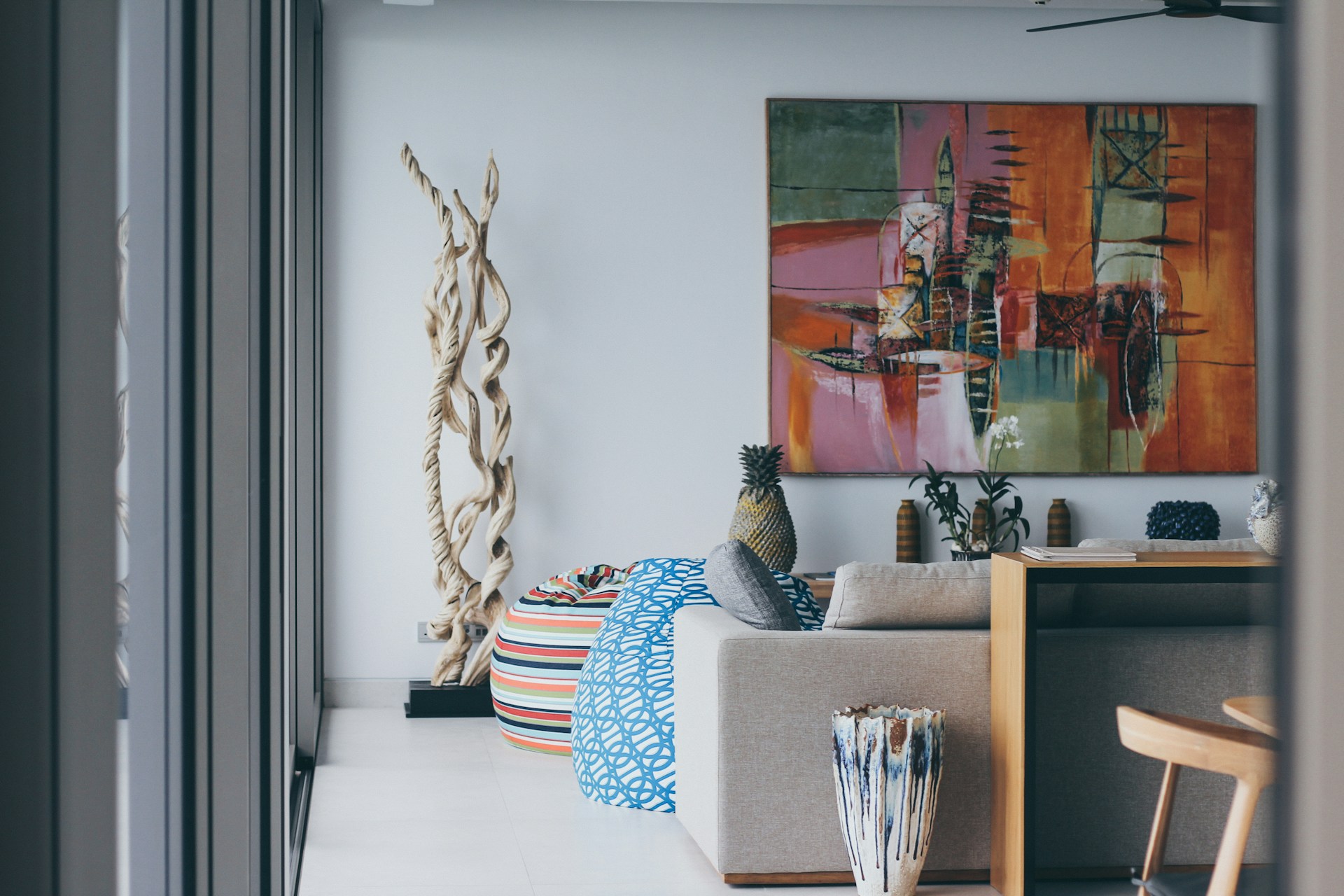 a living room with a painting on the wall