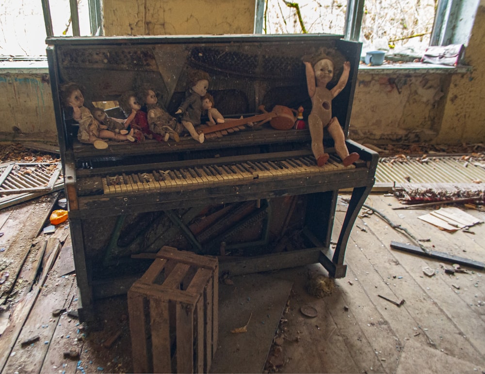 a group of people sitting on a piano