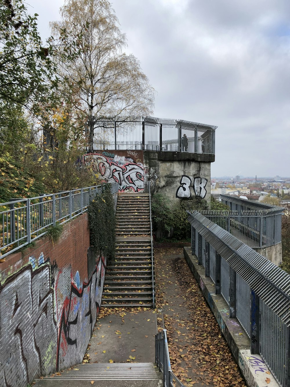 a stone bridge with graffiti