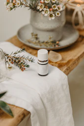 a white candle on a table