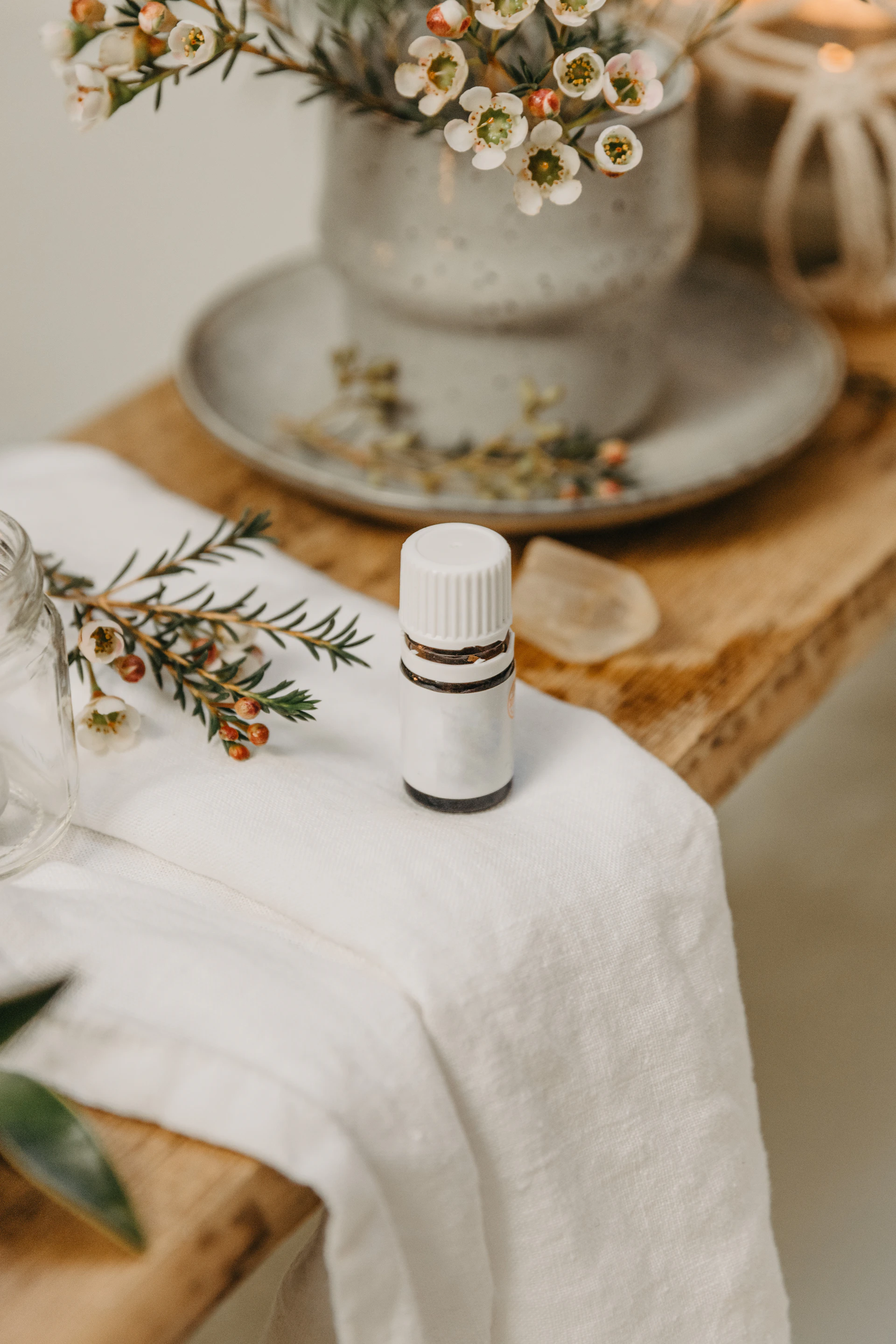 a white candle on a table