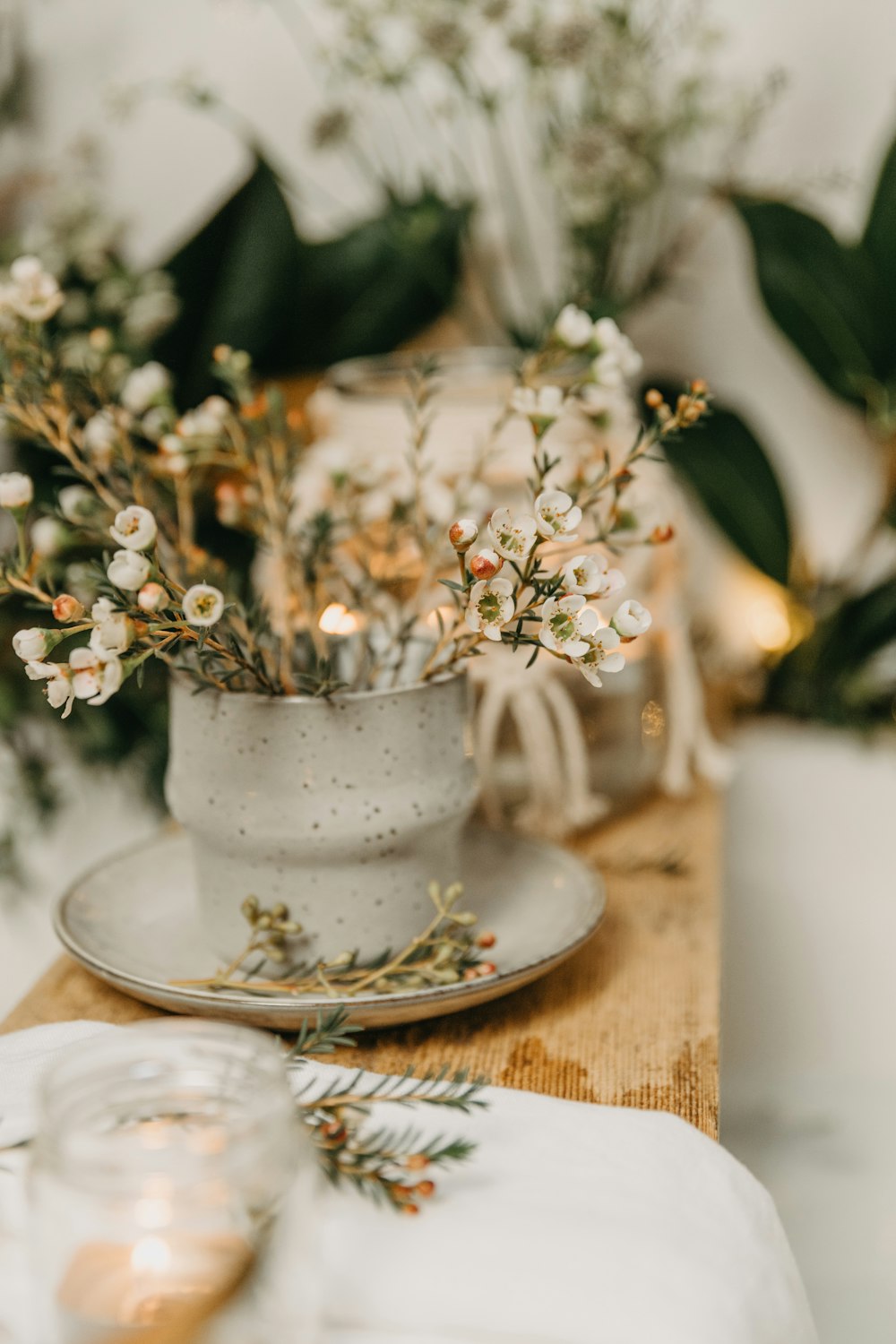 a white cup with flowers in it