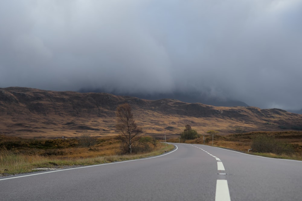 a road with a rainbow in the distance