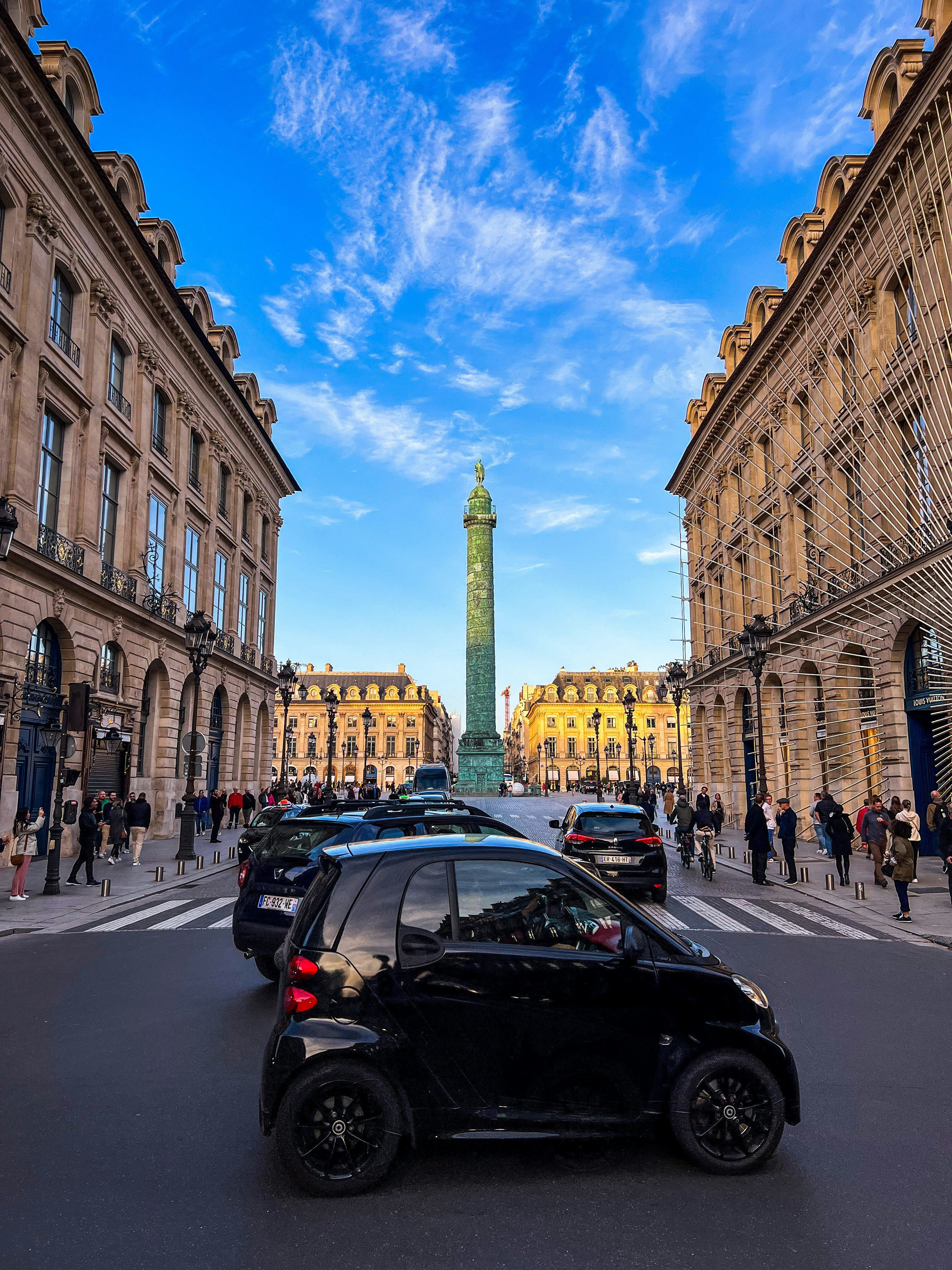 a street with cars and buildings on either side of it