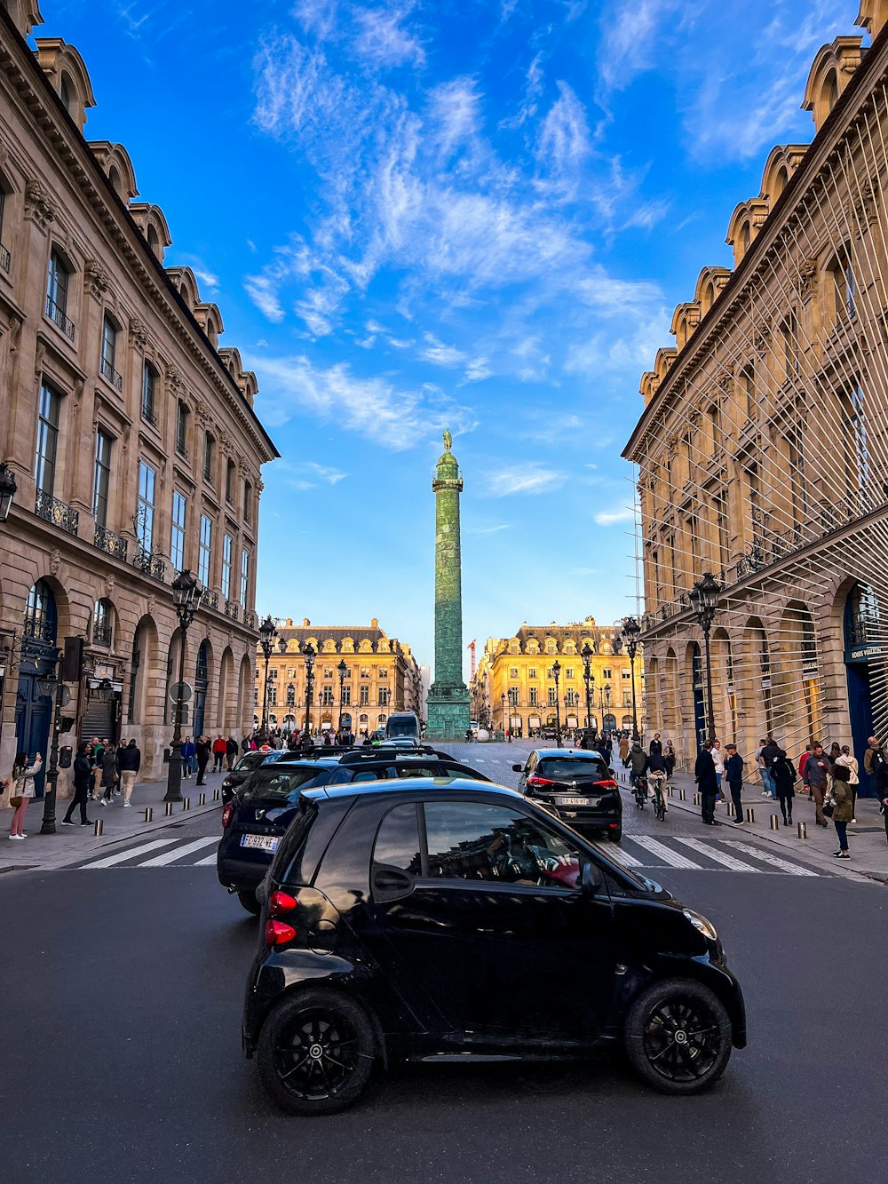 a street with cars and buildings on either side of it