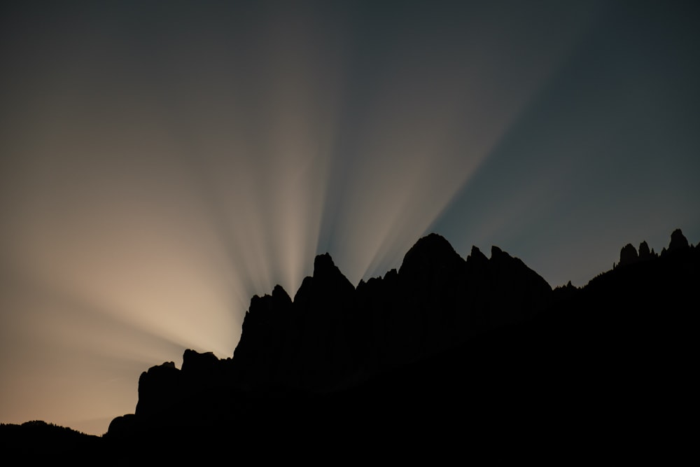 a silhouette of a mountain