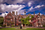 a large brick building with trees in front of it