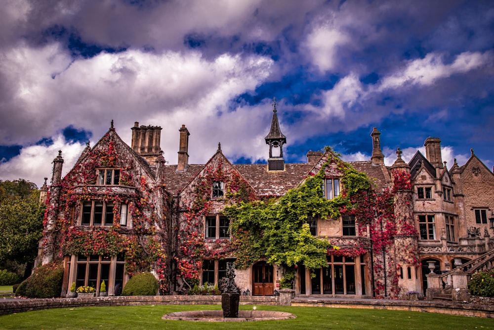 a large brick building with trees in front of it