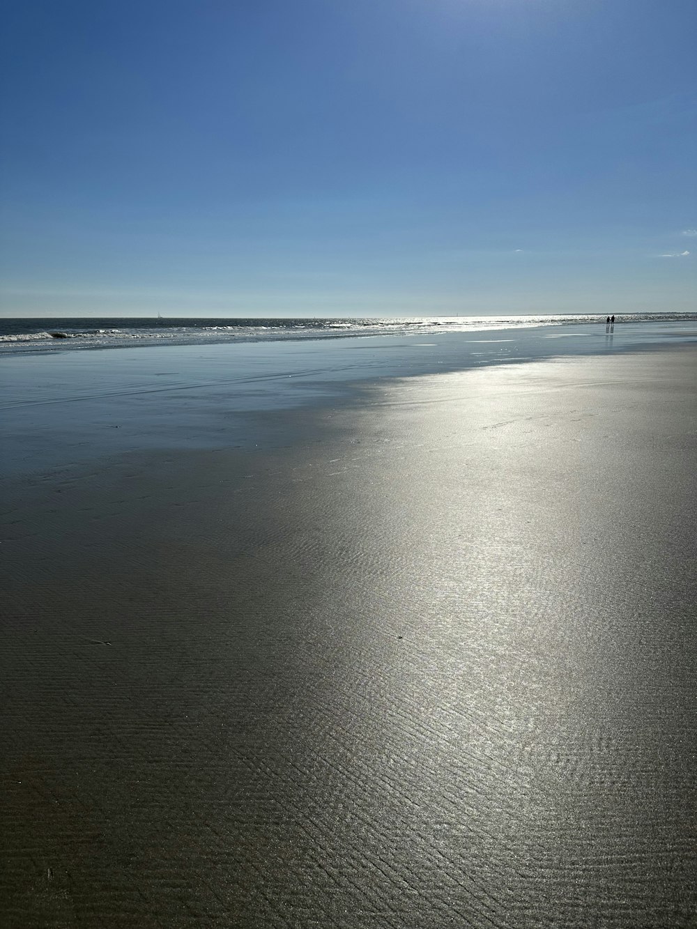 a beach with a body of water