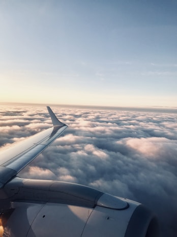 A stunning aerial view of an airplane flying above the clouds.