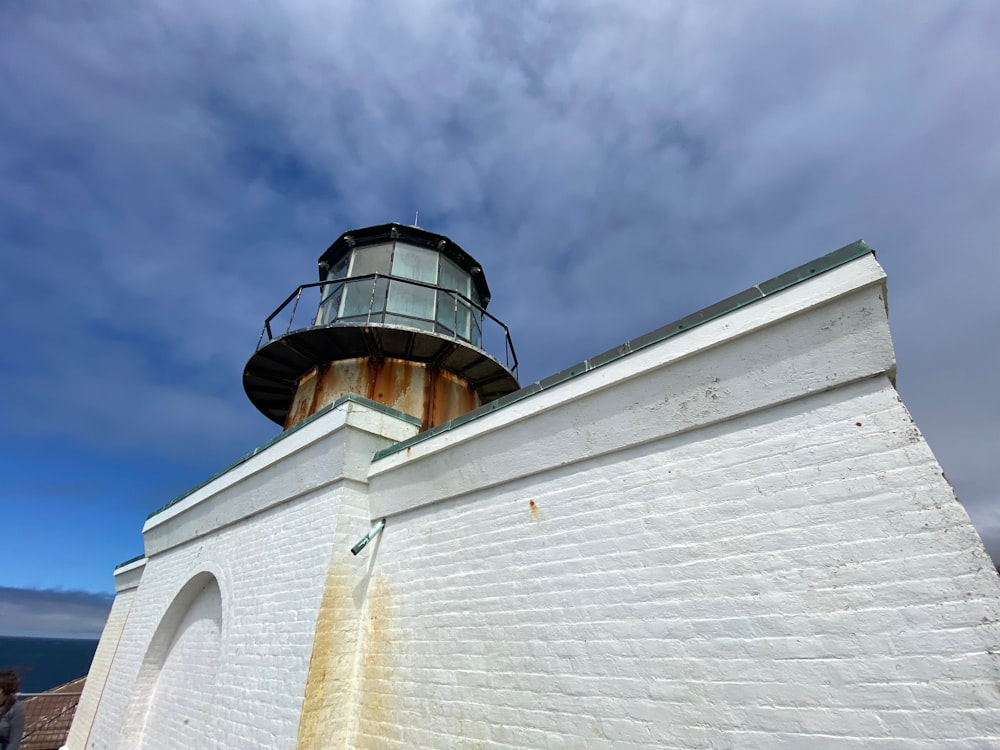 a white building with a round tower