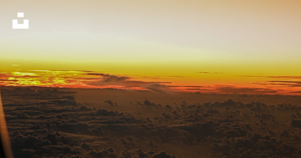 a view of a landscape with a sunset