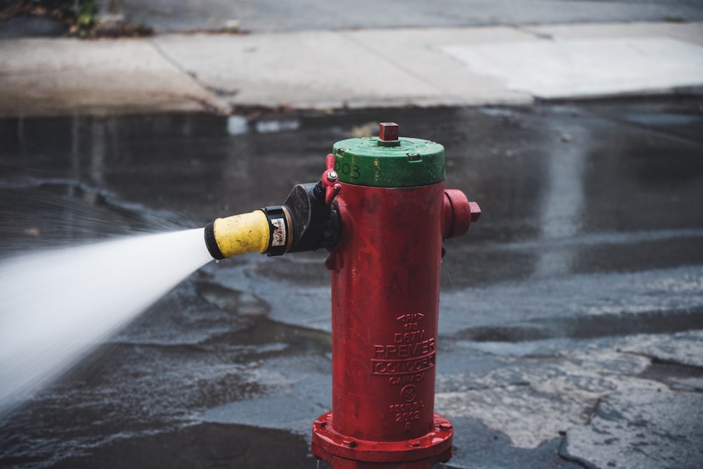 a red fire hydrant spraying water