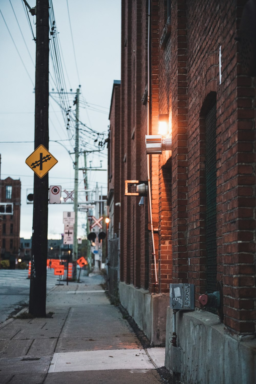 a street sign on a sidewalk