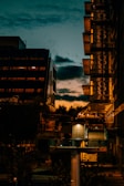 Urban landscape featuring contemporary residential buildings at sunset.