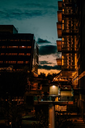Urban landscape featuring contemporary residential buildings at sunset.