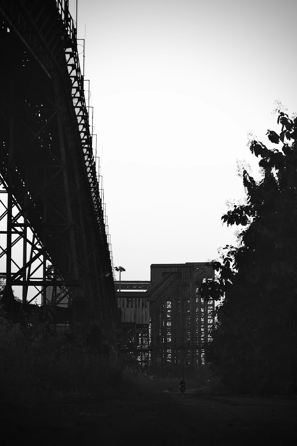 a bridge with a person walking on it