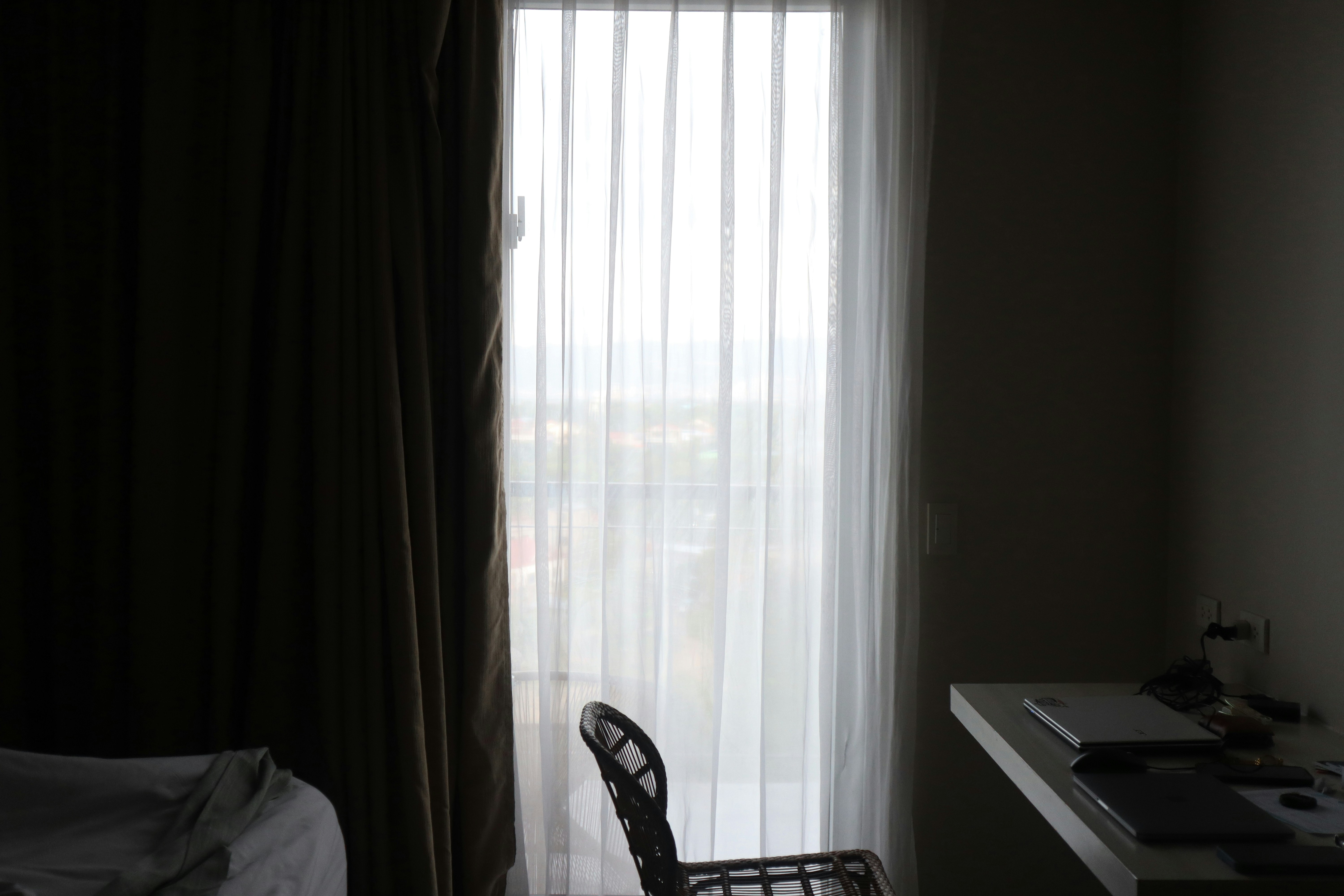 a guitar leaning against a window