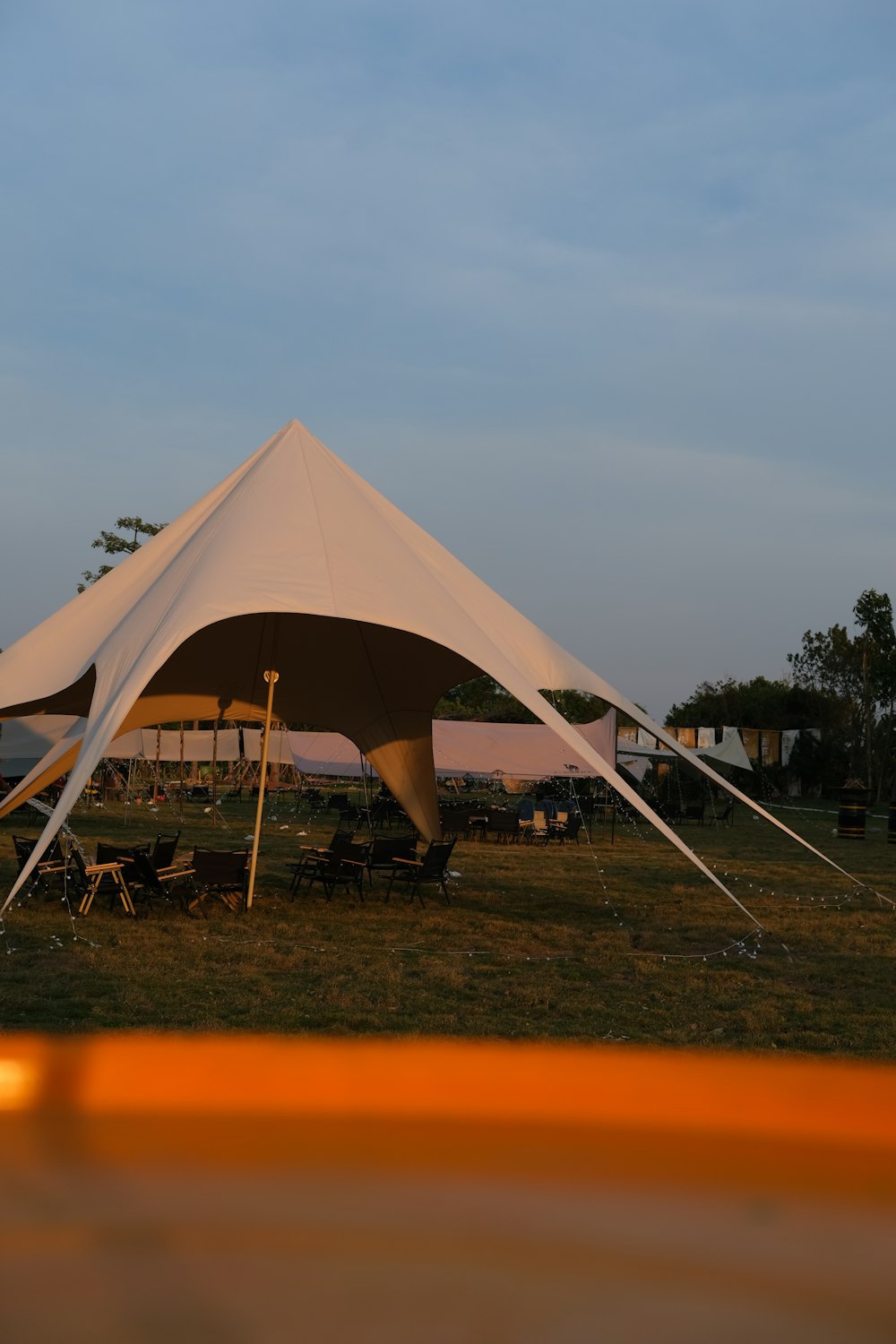 a white tent with a white canopy