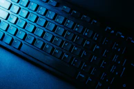 Close-up of a red shadowed keyboard with glowing keys symbolizing quick access.