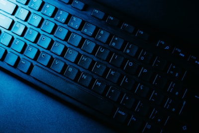 Close-up of a user’s hands typing numbers and symbols with highlighted keys.