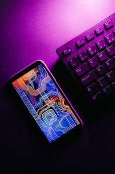 a cell phone on a keyboard