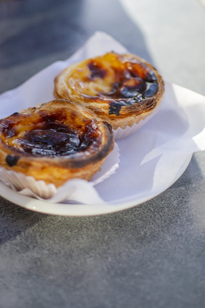 Two pastéis de nata on a plate