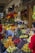 A vibrant market scene showcasing fresh fruits and vegetables, including bananas, avocados, and oranges.