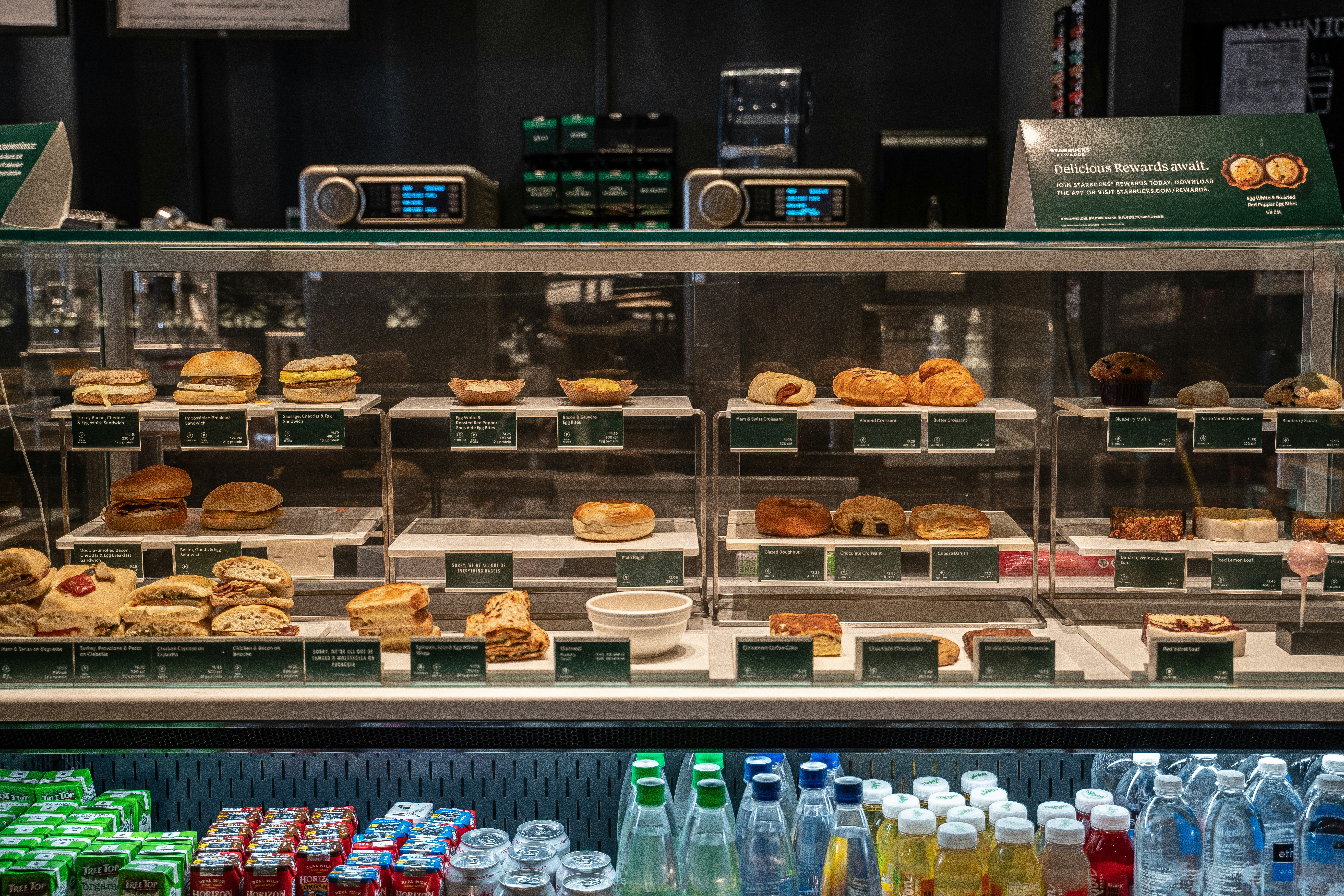 a bakery display case with many pastries