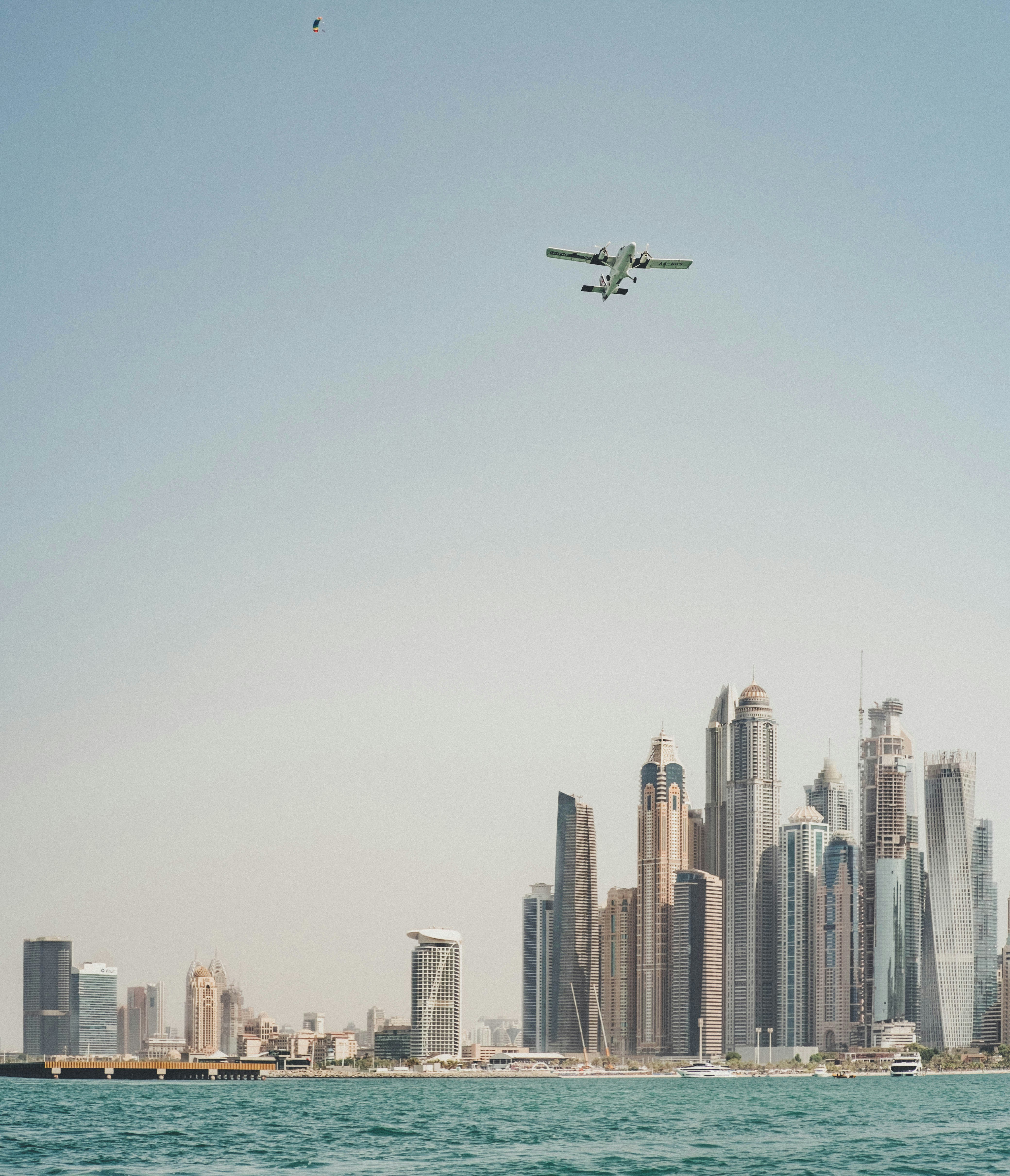 a plane flying over a city