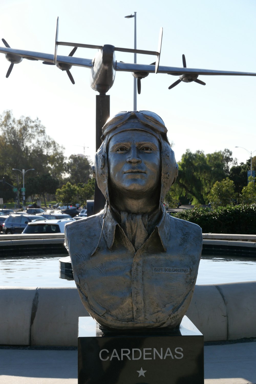 a statue of a person with a cross on top of it