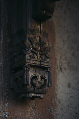 Wide view of a custom wooden wall art piece showcasing layered carving techniques.