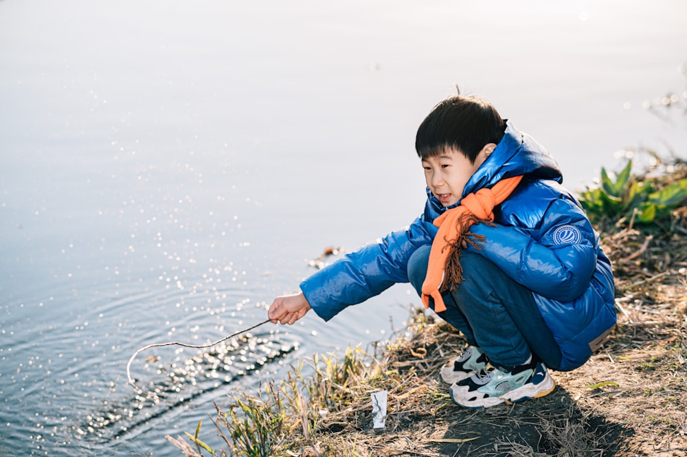 a boy fishing on a lake