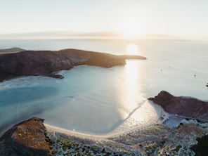 a beach with a body of water