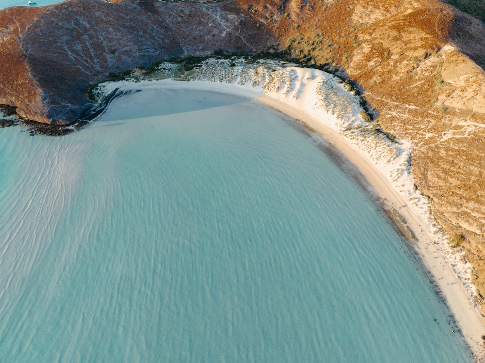 a body of water with a rocky shoreline