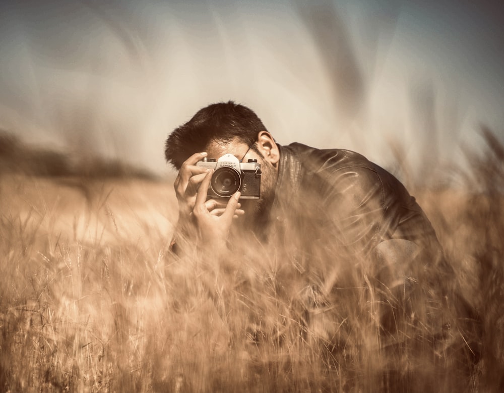 a man holding a camera