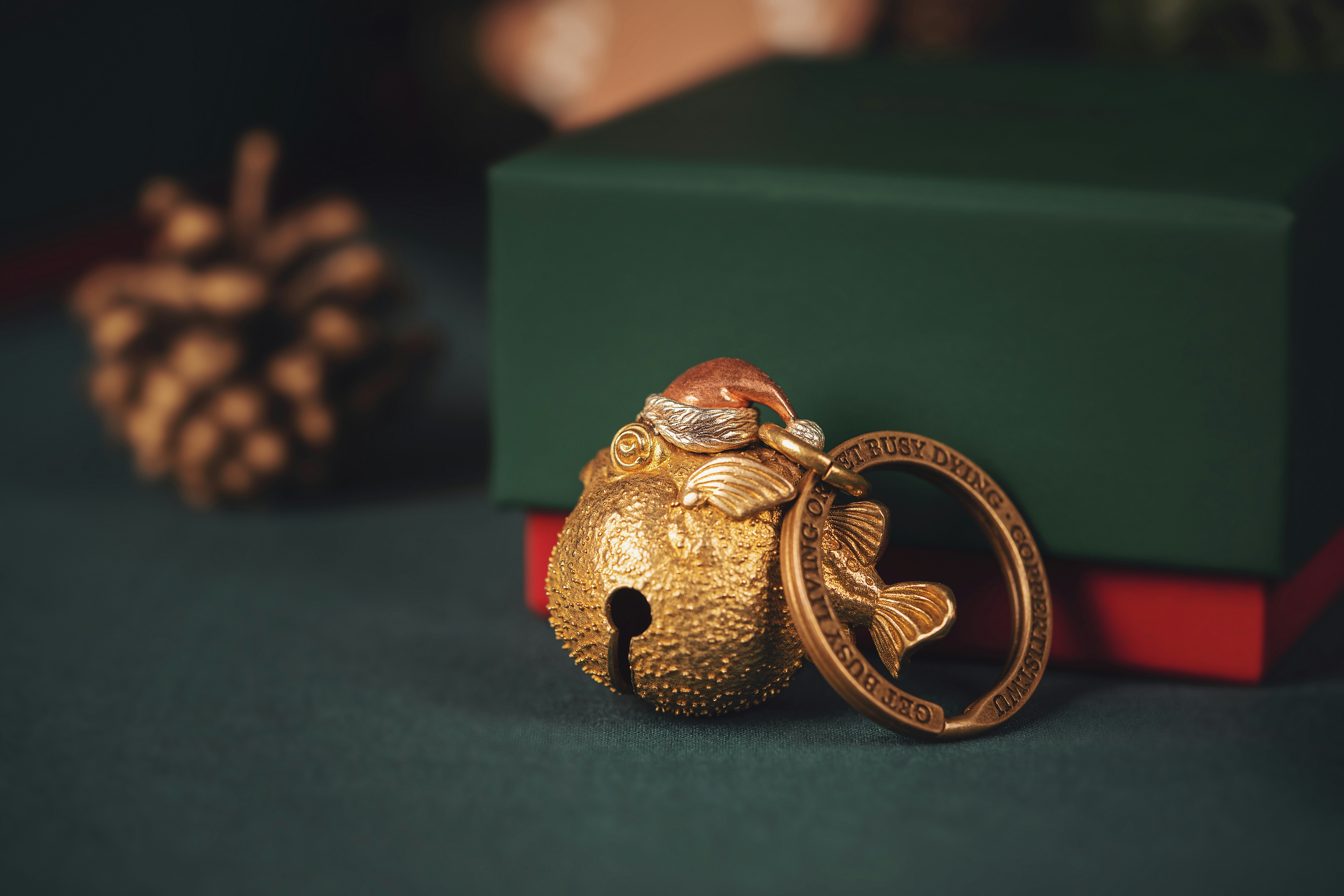A set of house keys with a festive or Christmas-themed decoration.