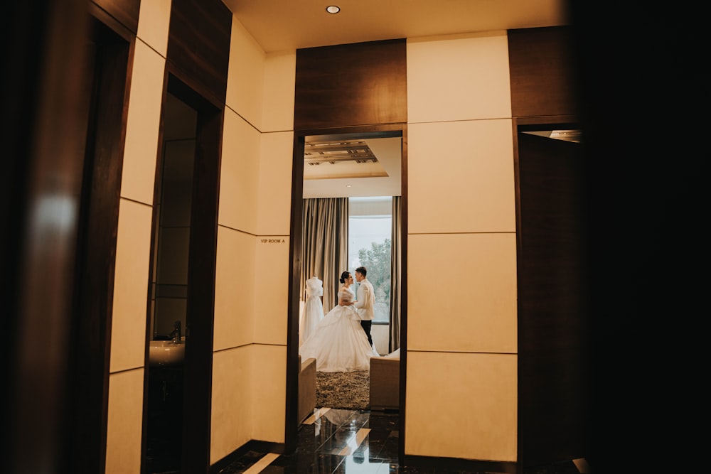 a bride and groom in a room