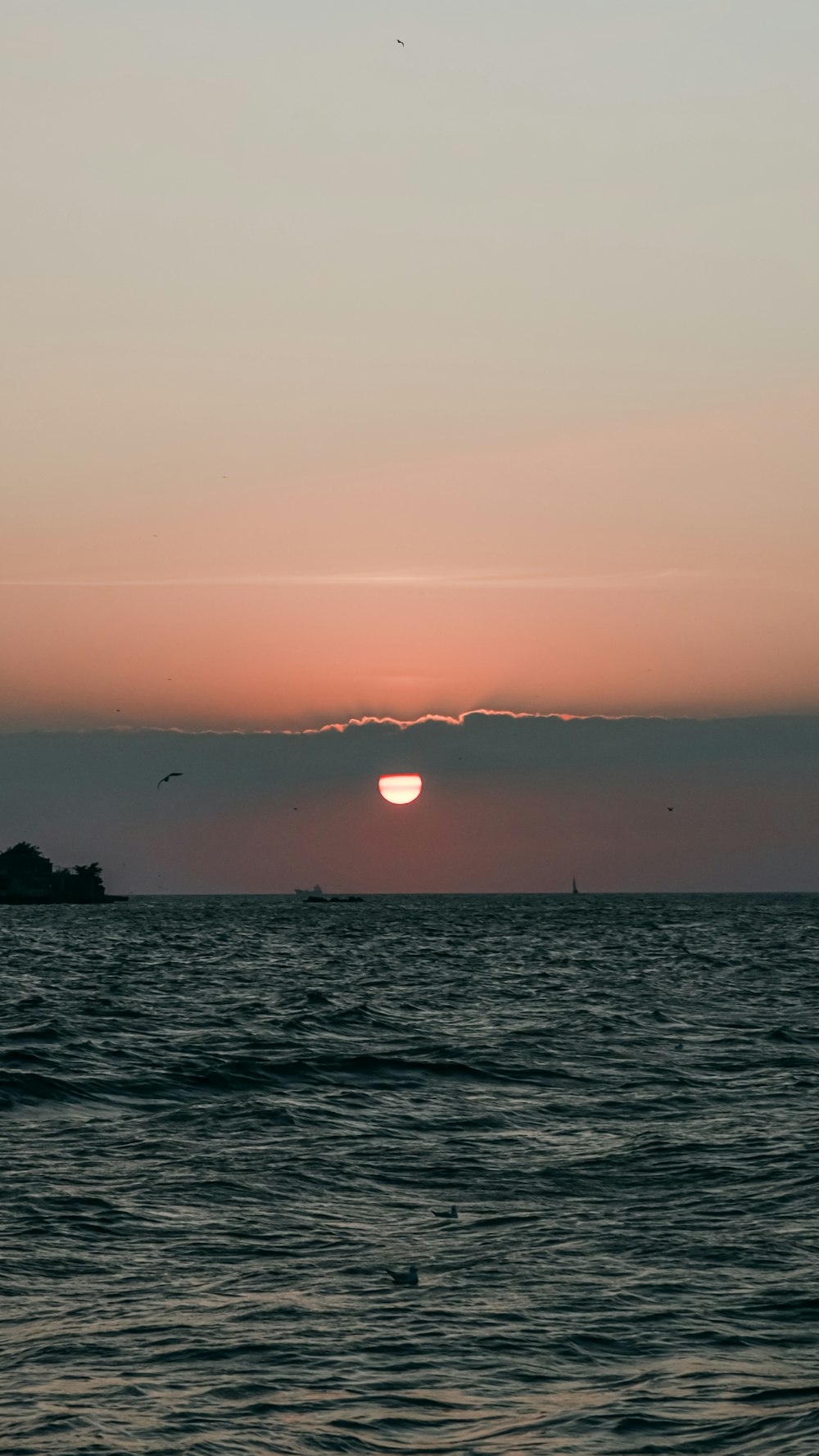 a body of water with a sunset