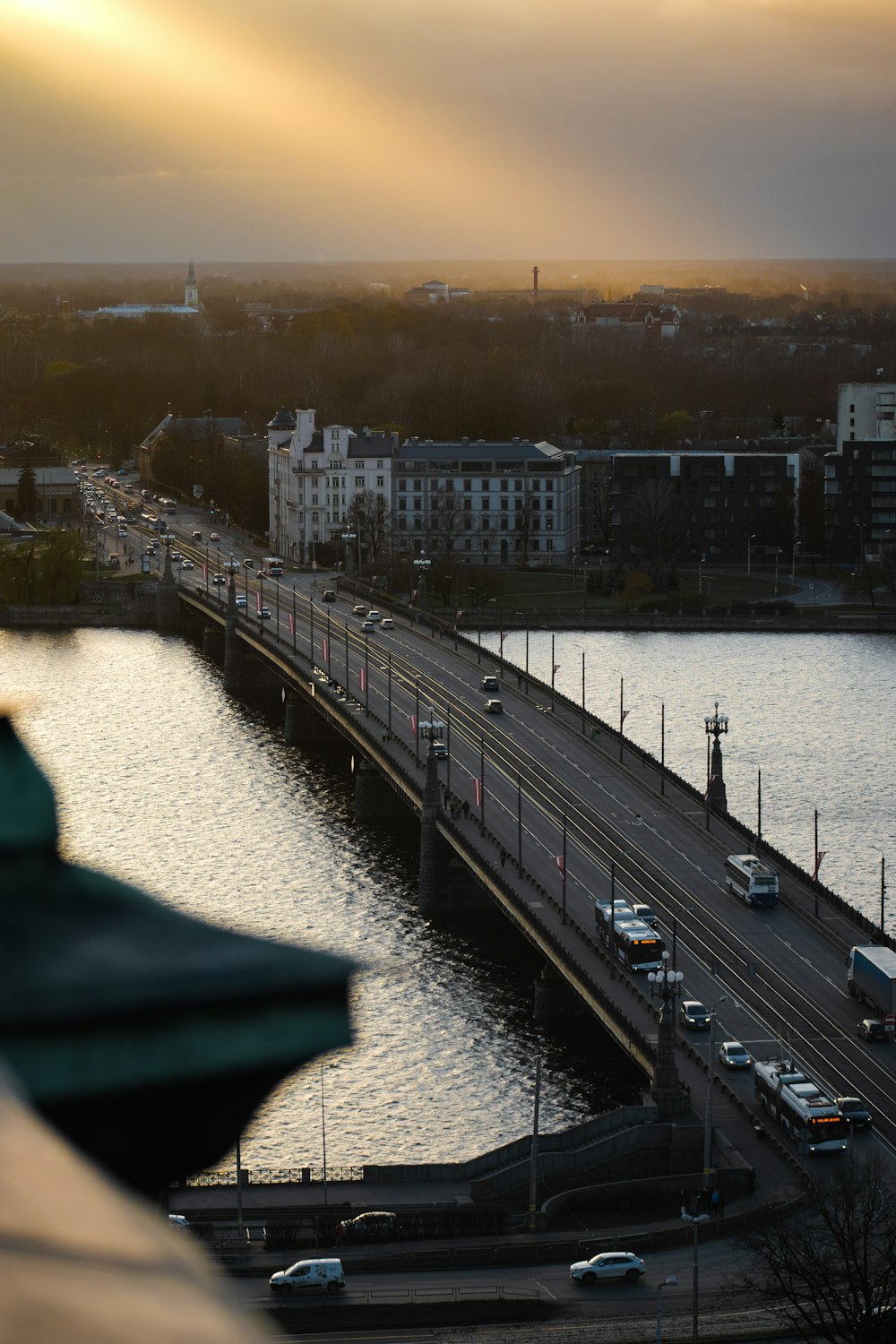 a bridge over a river with cars on it