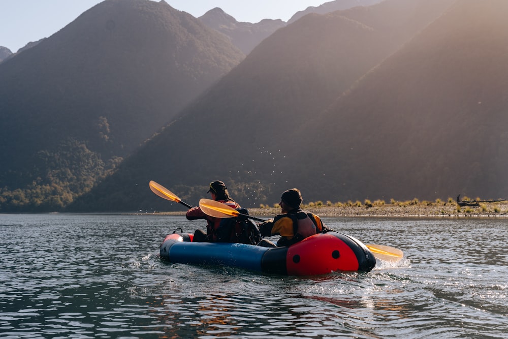 a group of people in a canoe on a lake