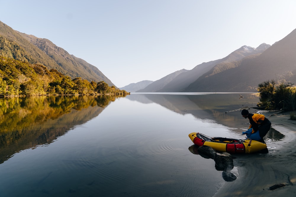 a person in a kayak on a lake