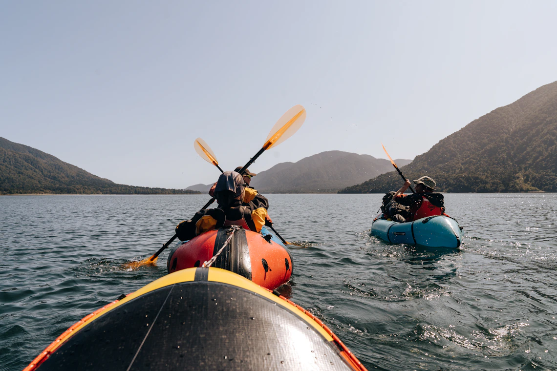 Kayaker exploring a mountain lake